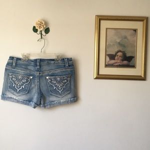 Denim shorts with embellished pockets